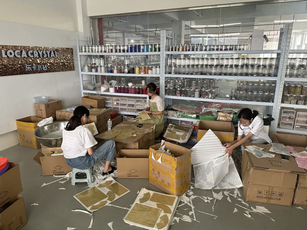 LOCACRYSTAL Shoe Patch motif assembly station at the LOCA brand wall with raw stone library shelves
